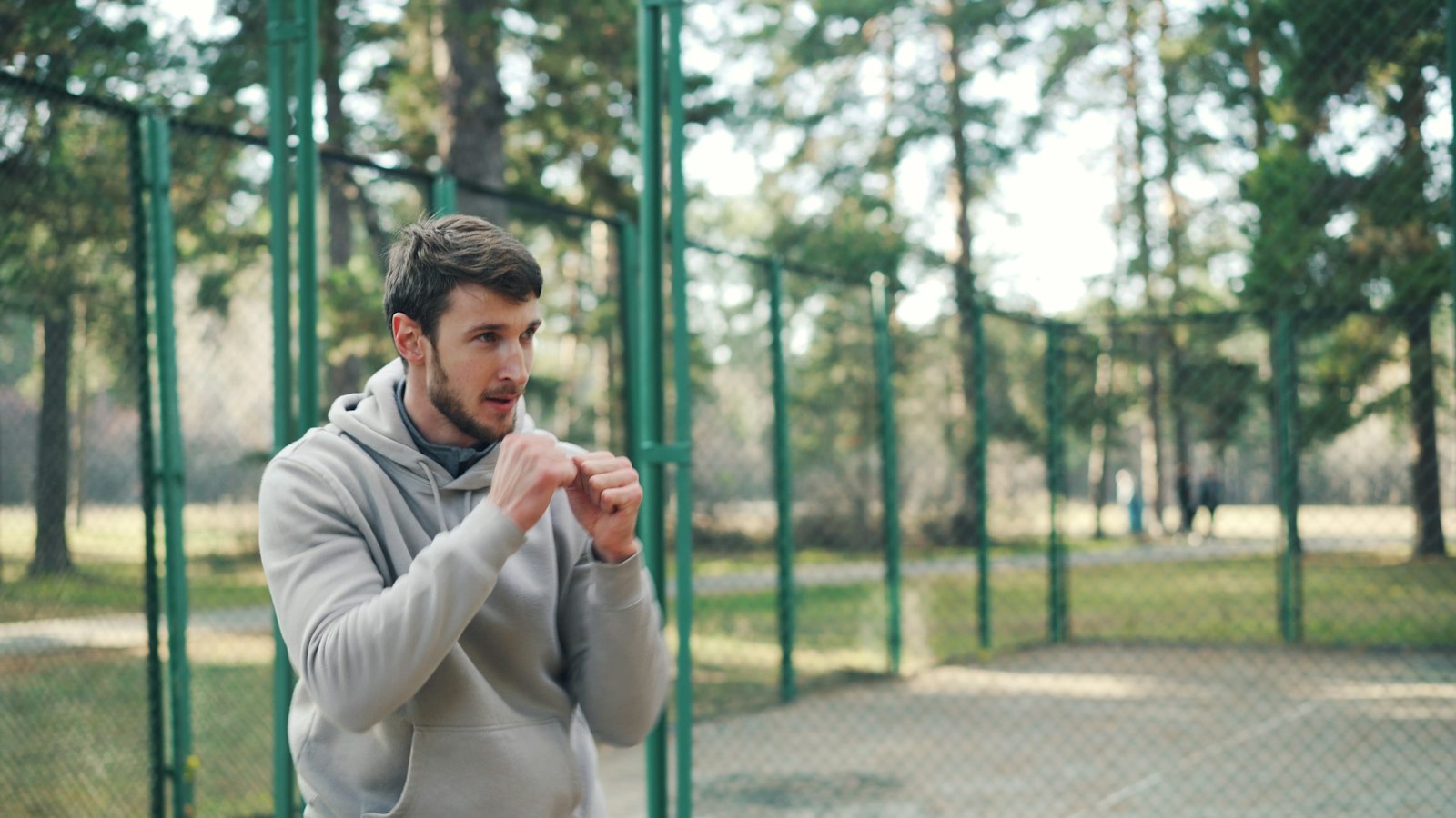 Man in his forties training with a kettlebell outdoors